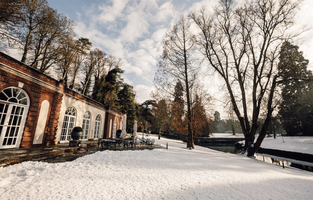 wide shot of The Orangery in Maidstone as the sun rises on the snowy scene. Image by Kent wedding photographer Tommy Reynolds